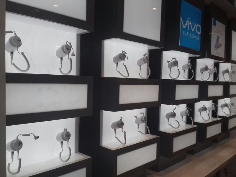 Acrylic price tag and sign holder in retail environment