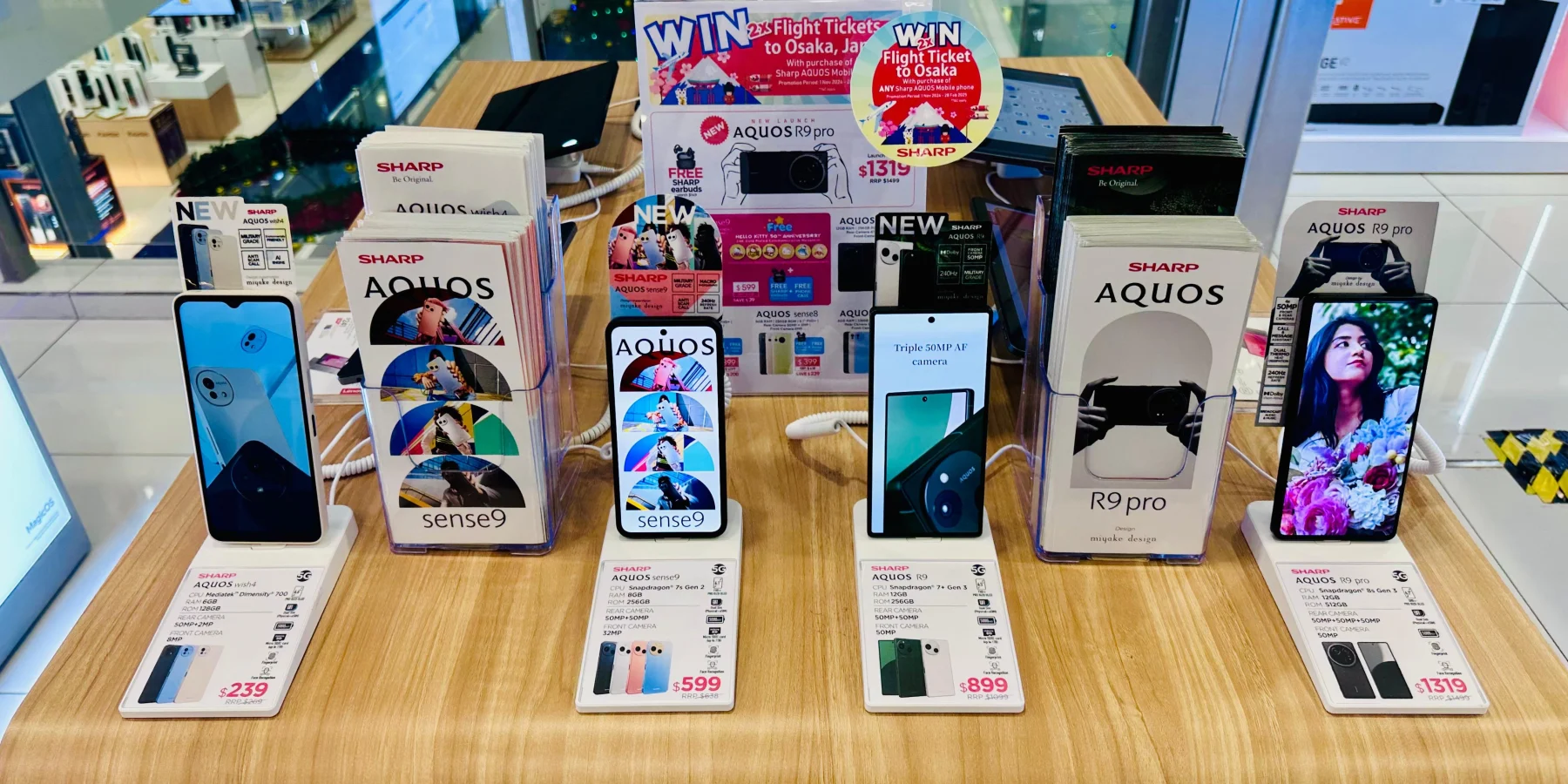 Sharp AQUOS phones displayed on PA-07 price tag security stands in Singapore