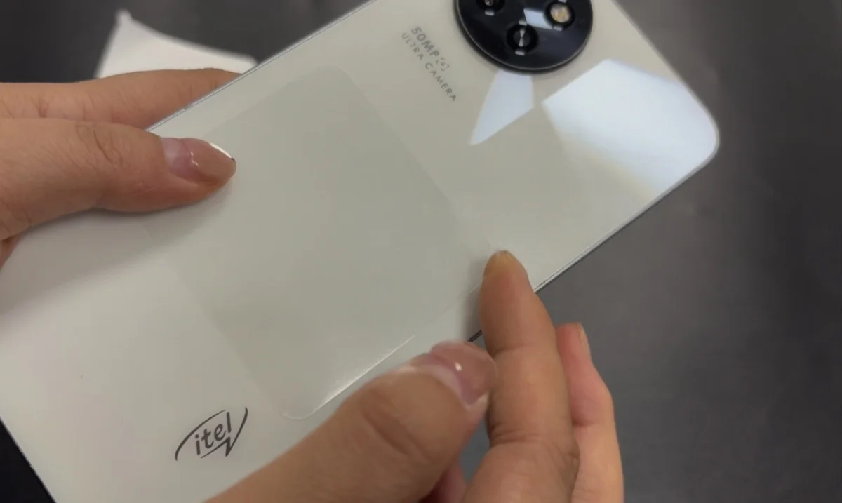 Applying AT6055 transparent pull-tab protective film to a phone back