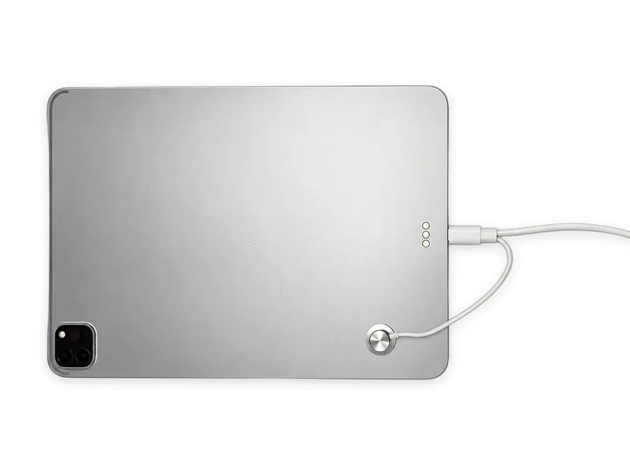 SC09_AP on the back of an iPad: round contact sensor attached to the back and device-end USB-C in the charging port