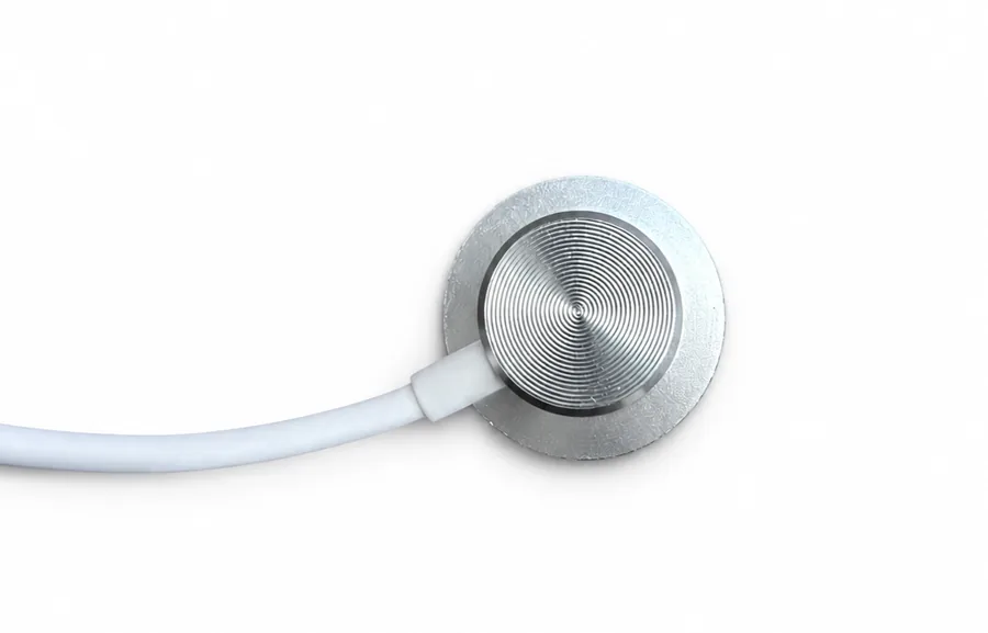 Close-up of the SC09_AP round contact sensor on its short lead